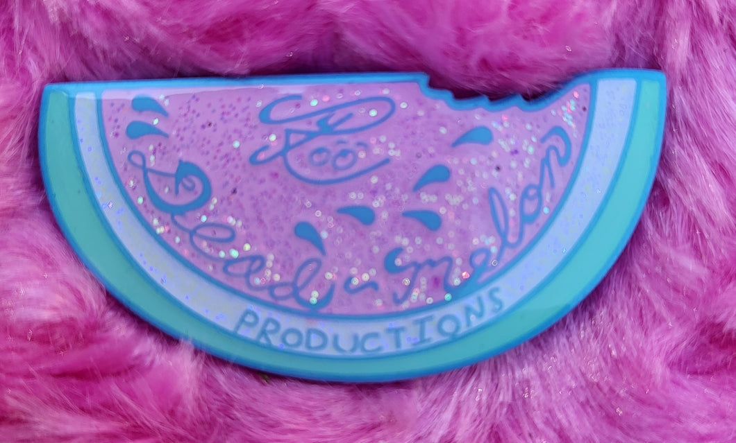 Logo blue dyed metal with pink and glitter